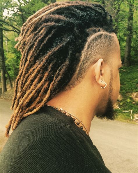 braided dread styles men|dreadlock ponytail styles for men.